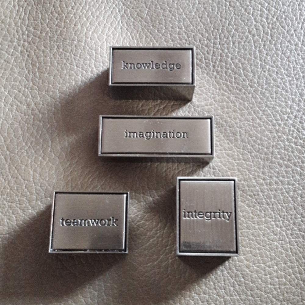 All 4 small silver toned signs